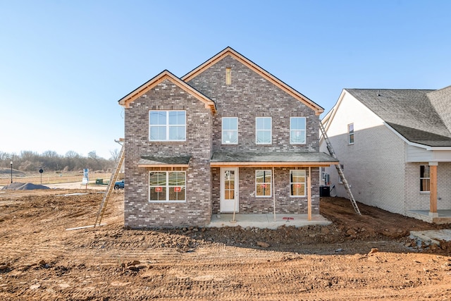 rear view of property featuring a patio