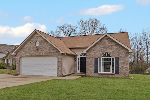 view of front of house featuring a garage and a front yard