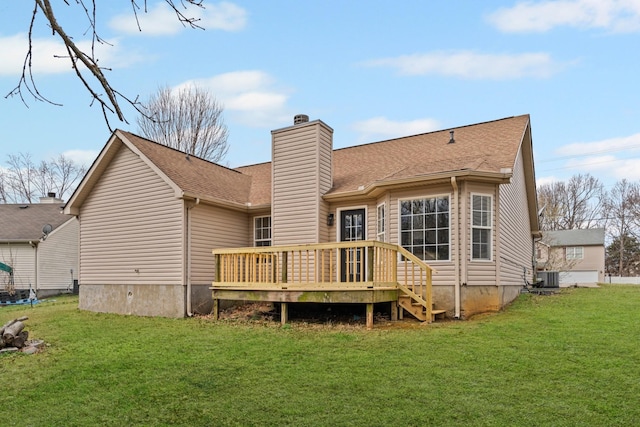 back of house with cooling unit, a yard, and a wooden deck