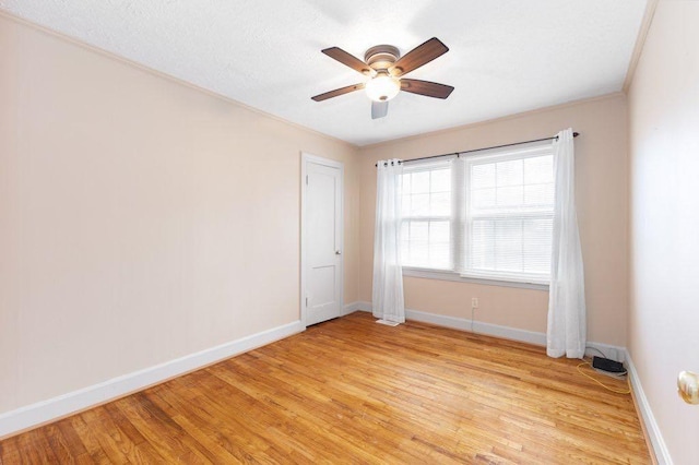 unfurnished room featuring ceiling fan and light wood-type flooring