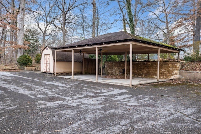 view of car parking featuring ceiling fan