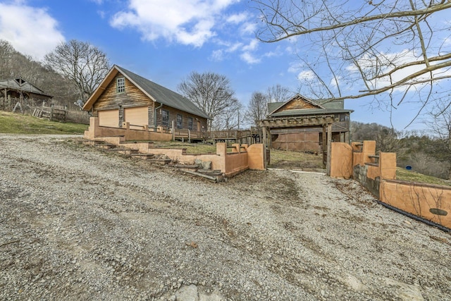 view of side of home with a garage