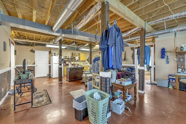 basement with white refrigerator