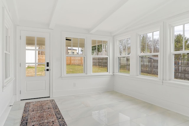 unfurnished sunroom with vaulted ceiling