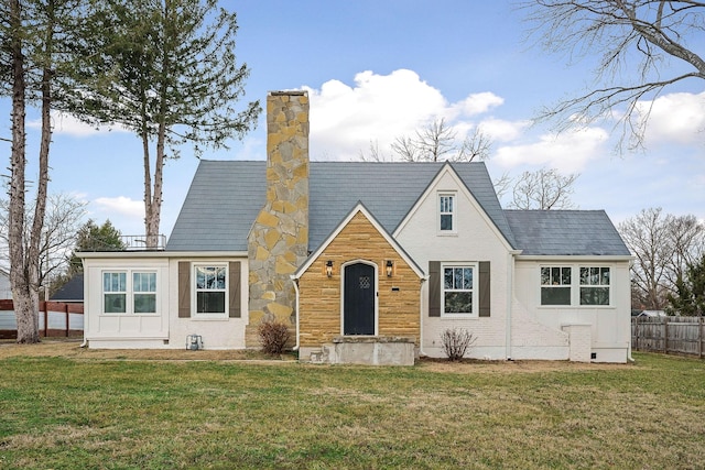 back of property featuring a lawn