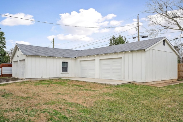 garage with a yard