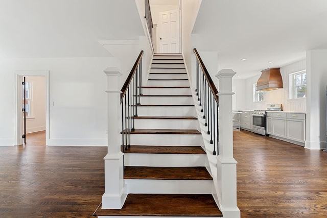 stairway with hardwood / wood-style flooring