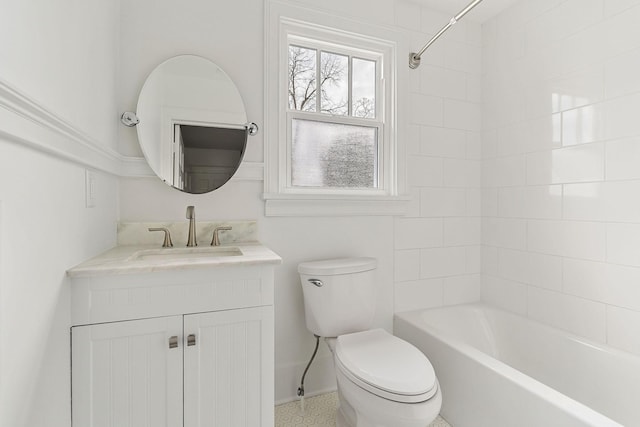 full bathroom with vanity, toilet, and tiled shower / bath