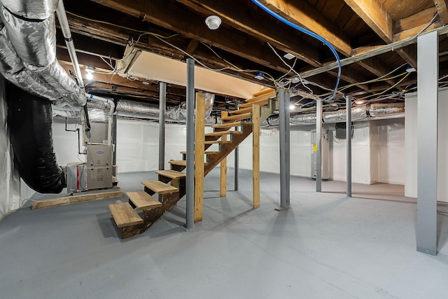 basement featuring electric water heater and heating unit