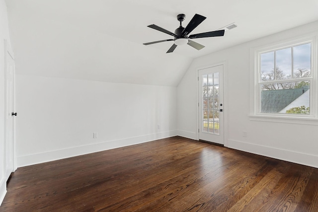 additional living space featuring dark hardwood / wood-style flooring, lofted ceiling, and ceiling fan