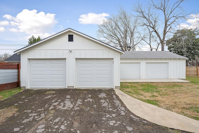 garage featuring a yard