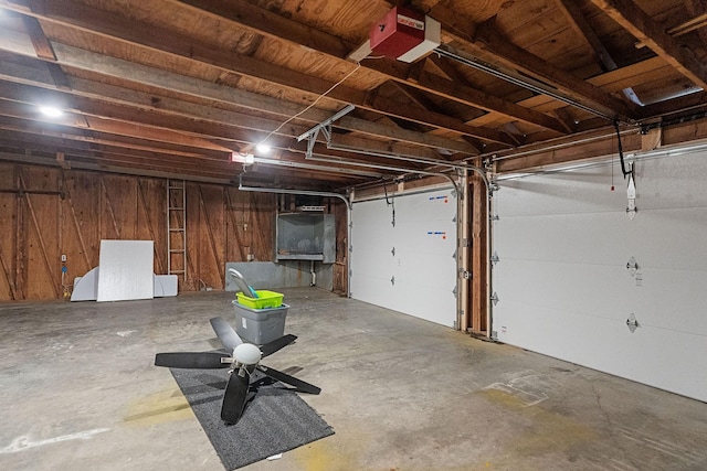 garage featuring wooden walls