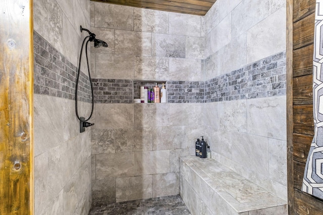 bathroom featuring a tile shower