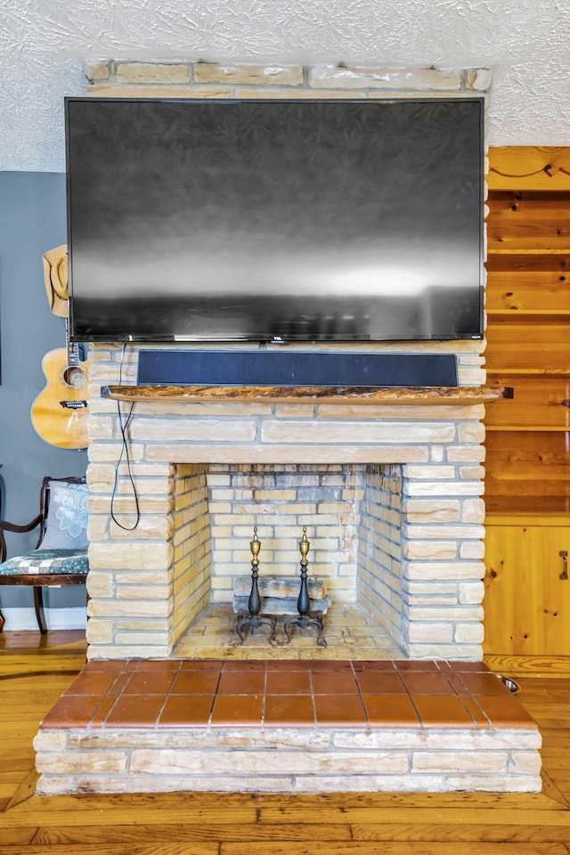 room details featuring hardwood / wood-style floors and a textured ceiling