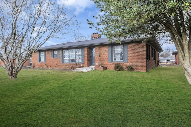 ranch-style home featuring a front yard