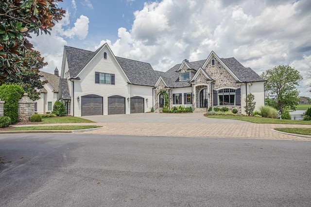 french country inspired facade with a garage