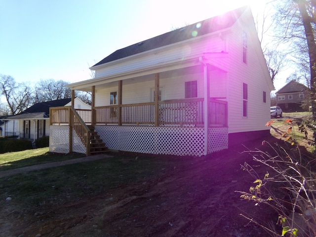 view of property exterior featuring covered porch