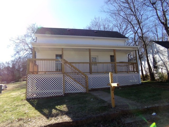 back of house featuring a porch