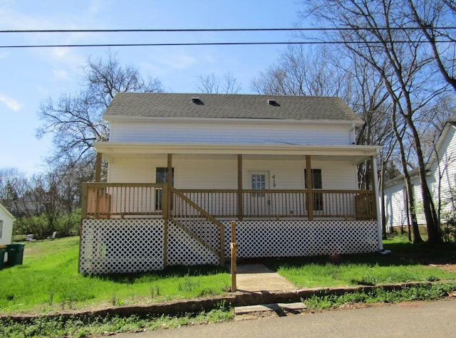 419 Cedar St, Lewisburg, TN 37091 - farmhouse with covered porch, a front yard, and a shingled roof