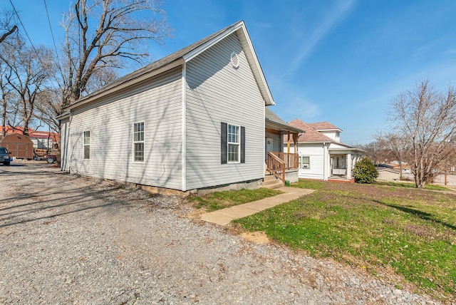 view of home's exterior with a yard