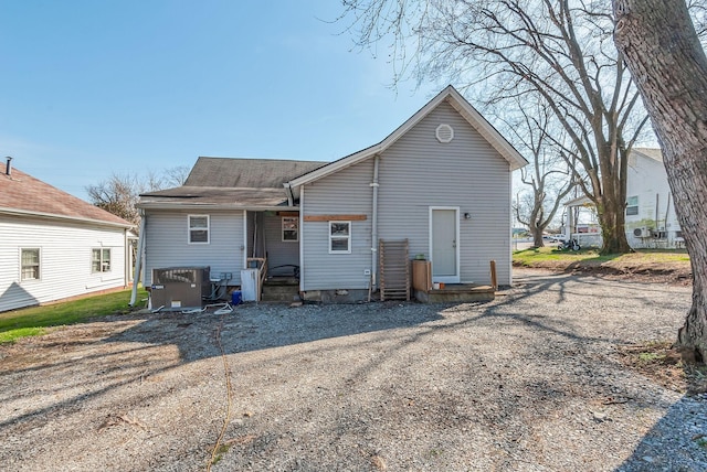 rear view of property with central air condition unit