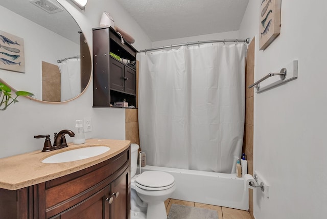 full bathroom with tile patterned floors, toilet, a textured ceiling, vanity, and shower / bathtub combination with curtain