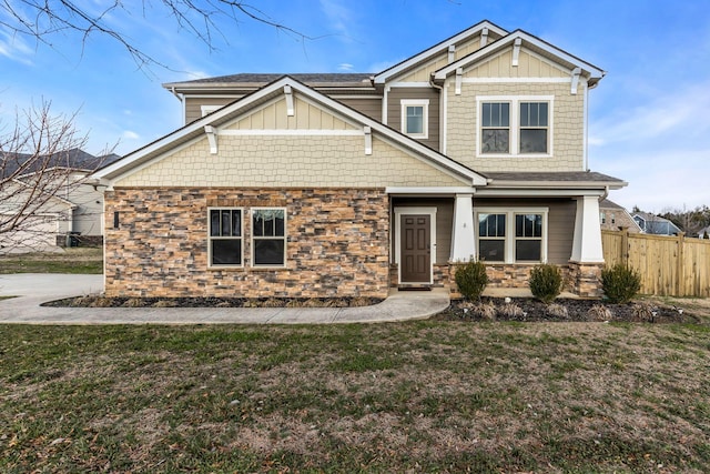 craftsman house featuring a front lawn