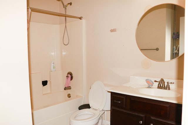 full bathroom featuring vanity, bathing tub / shower combination, and toilet