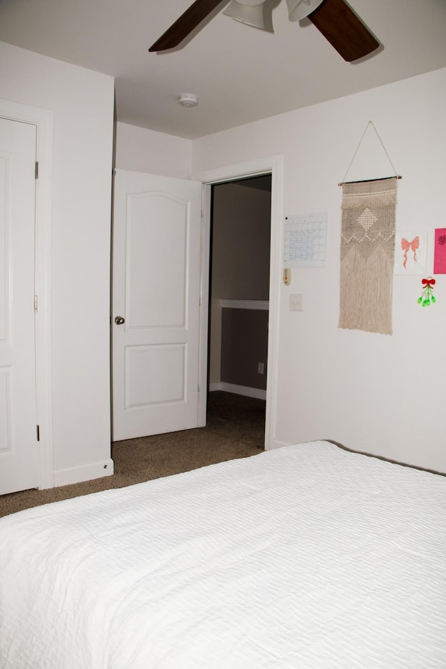 unfurnished bedroom featuring carpet and ceiling fan