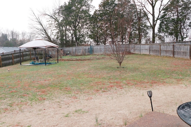 view of yard with a gazebo and a trampoline