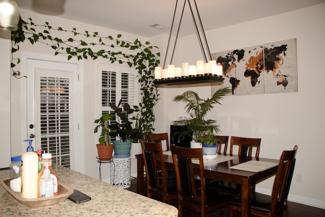 dining room featuring dark hardwood / wood-style flooring