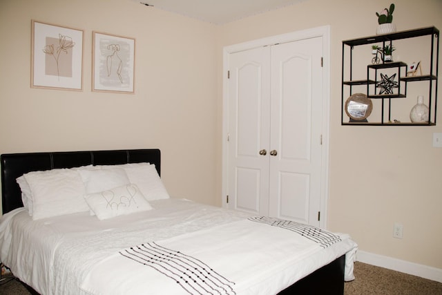 bedroom featuring a closet and carpet flooring