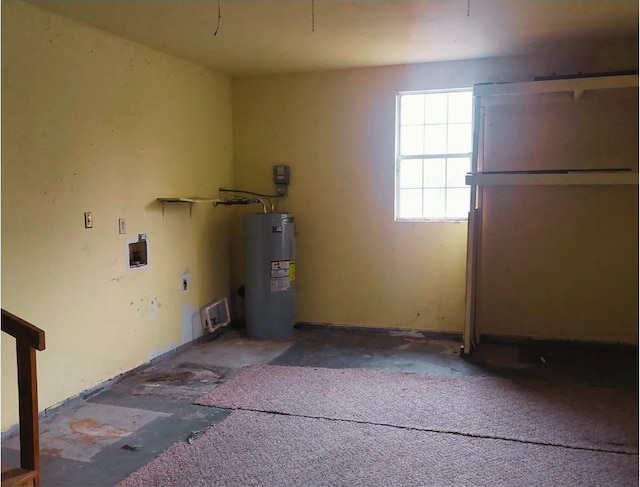 laundry room with electric water heater