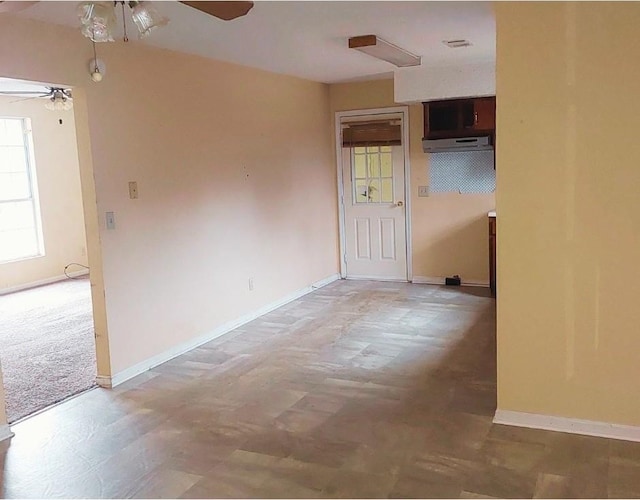 spare room with ceiling fan
