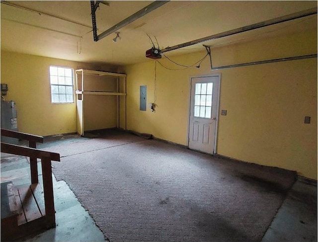 garage featuring a garage door opener and electric panel