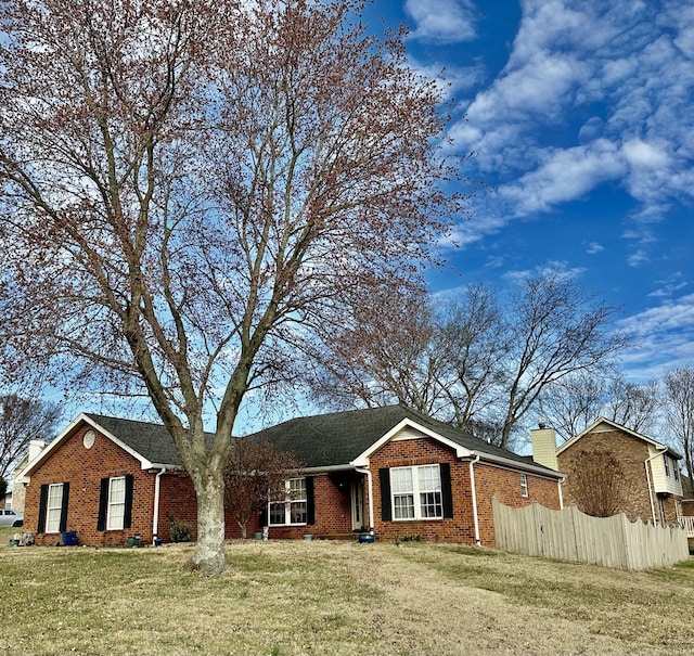 ranch-style house with a front lawn