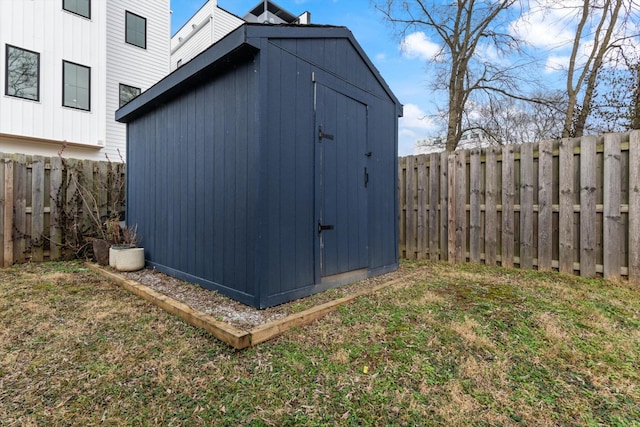 view of outbuilding with a yard