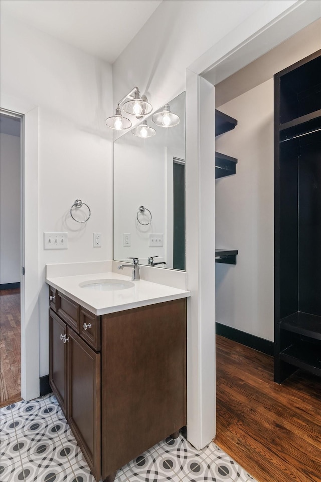 bathroom featuring vanity and hardwood / wood-style floors