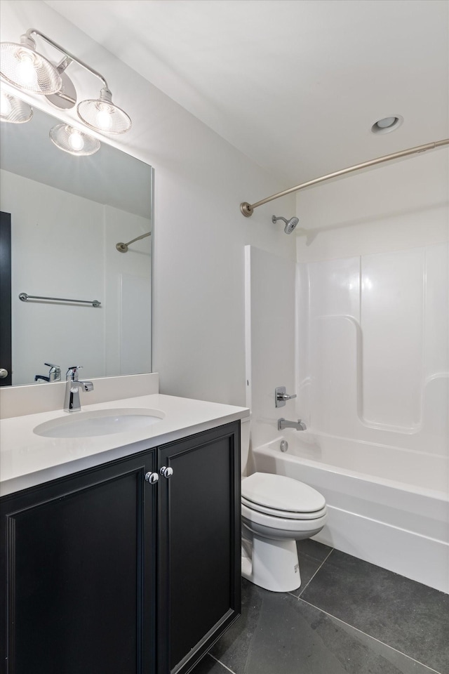 full bathroom featuring bathing tub / shower combination, vanity, tile patterned floors, and toilet