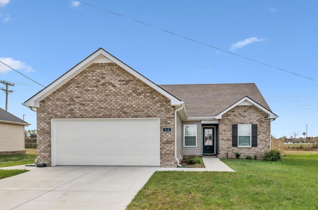 view of front facade featuring a garage and a front lawn