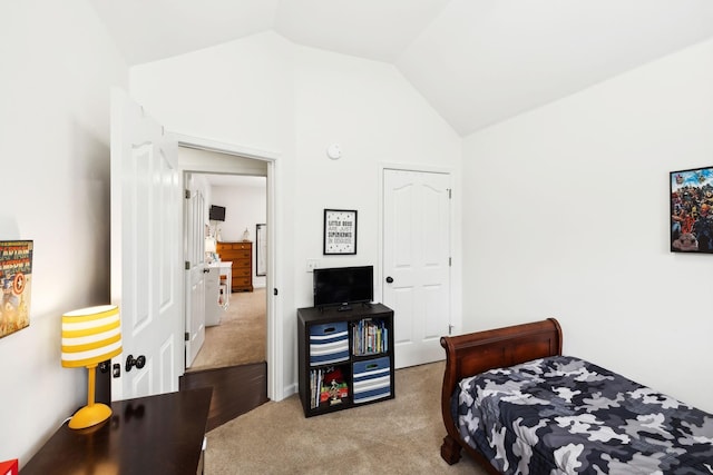 carpeted bedroom featuring vaulted ceiling