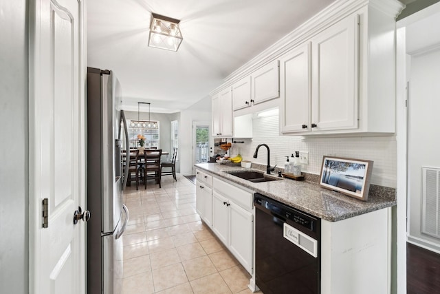 kitchen with white cabinets, sink, stainless steel refrigerator, and dishwasher