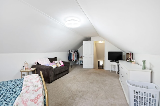 bedroom featuring vaulted ceiling and light carpet