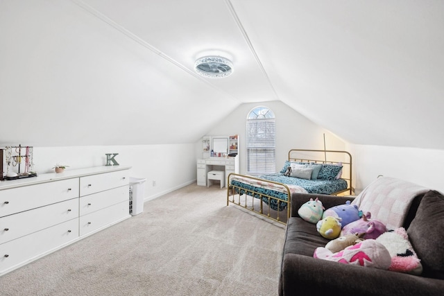 carpeted bedroom with vaulted ceiling