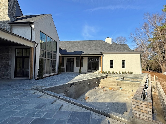 rear view of property with a patio