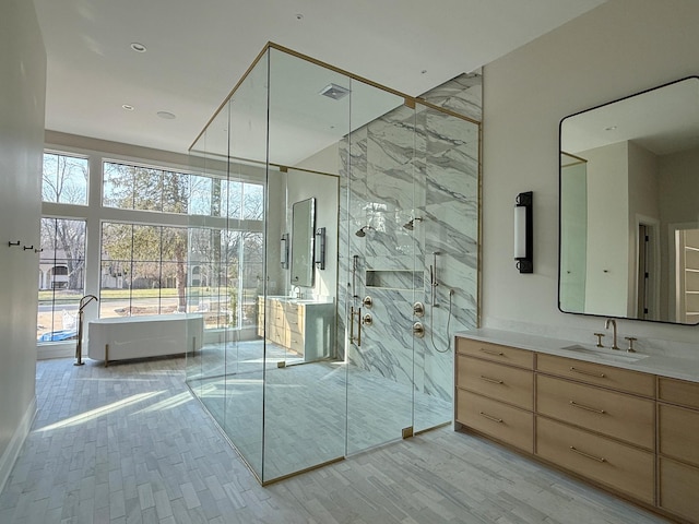 bathroom featuring vanity and a shower with shower door