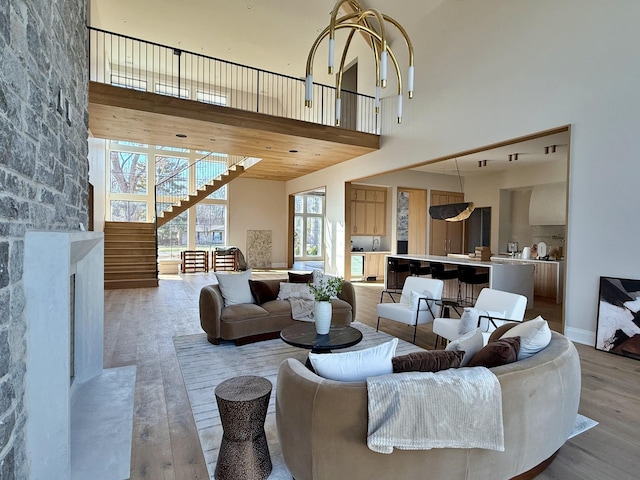 living room featuring hardwood / wood-style floors and a towering ceiling