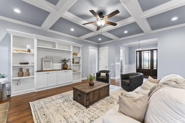 living area featuring beamed ceiling, coffered ceiling, ornamental molding, and dark wood-style flooring