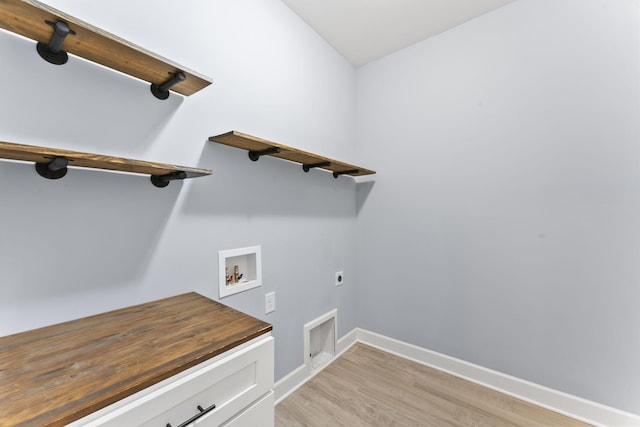 washroom with light wood-type flooring, baseboards, hookup for an electric dryer, hookup for a washing machine, and laundry area