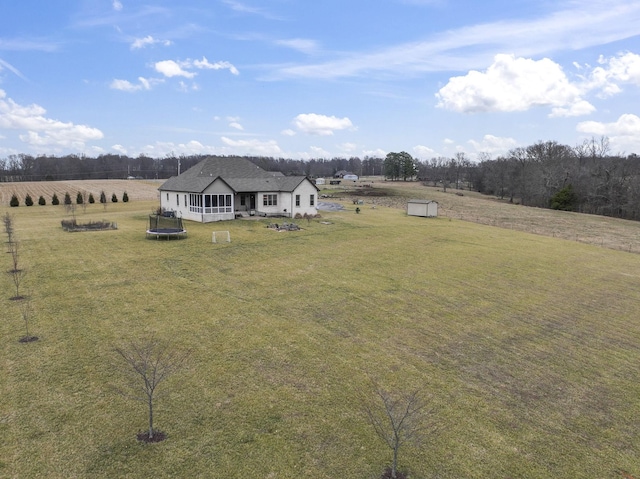 birds eye view of property with a rural view